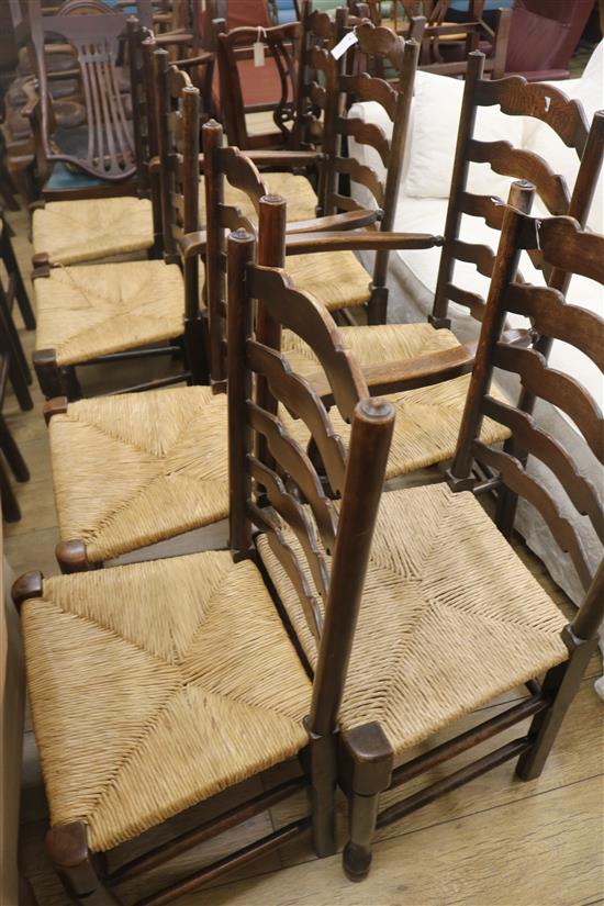 Eleven rush seat ladderback type chairs including two carvers